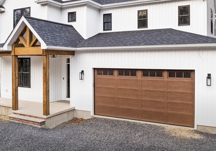 Professional technician providing local garage door repair services at a residential property, showcasing Mariner Garage Door Repair's expertise and on-site solutions