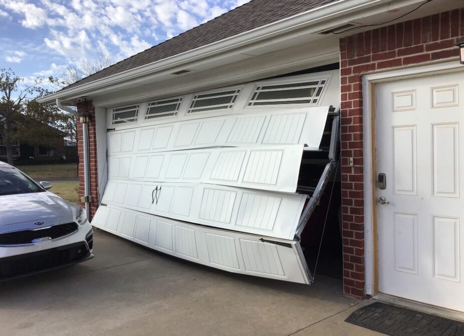 Professional technician performing garage door repair service at Mariner Garage Door Repair, ensuring smooth operation and safety for residential properties.